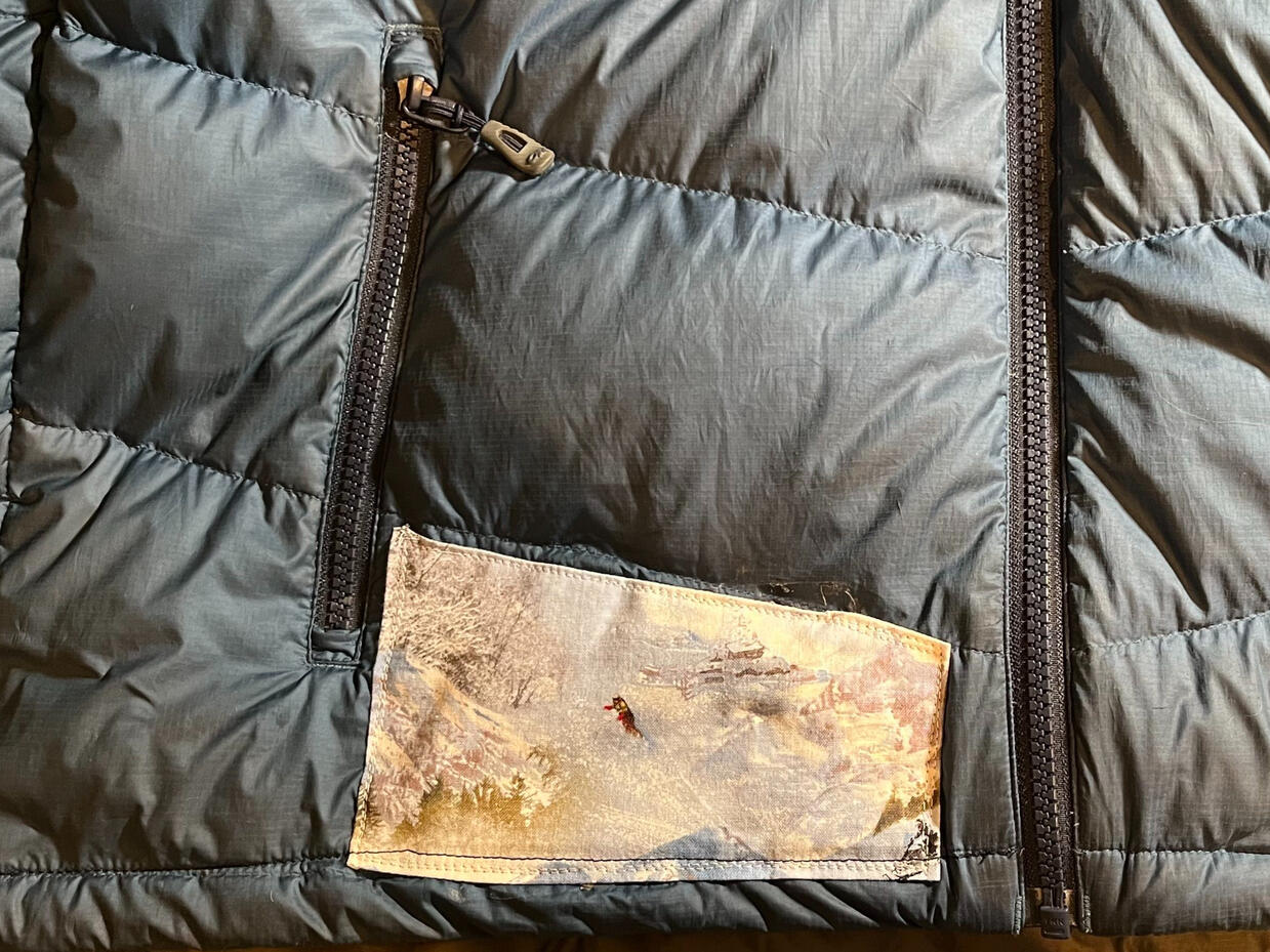 Fabric patch on down jacket